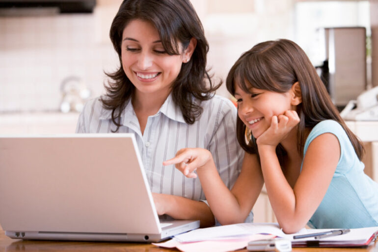 mothers in college showing their child their work