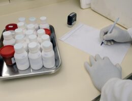 Pharmacist filling out a subscription