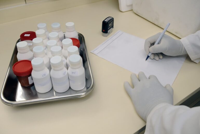 Pharmacist filling out a subscription