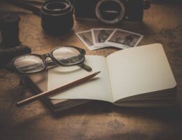 A unique display of pictures, a notebook and glasses