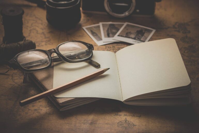 A unique display of pictures, a notebook and glasses