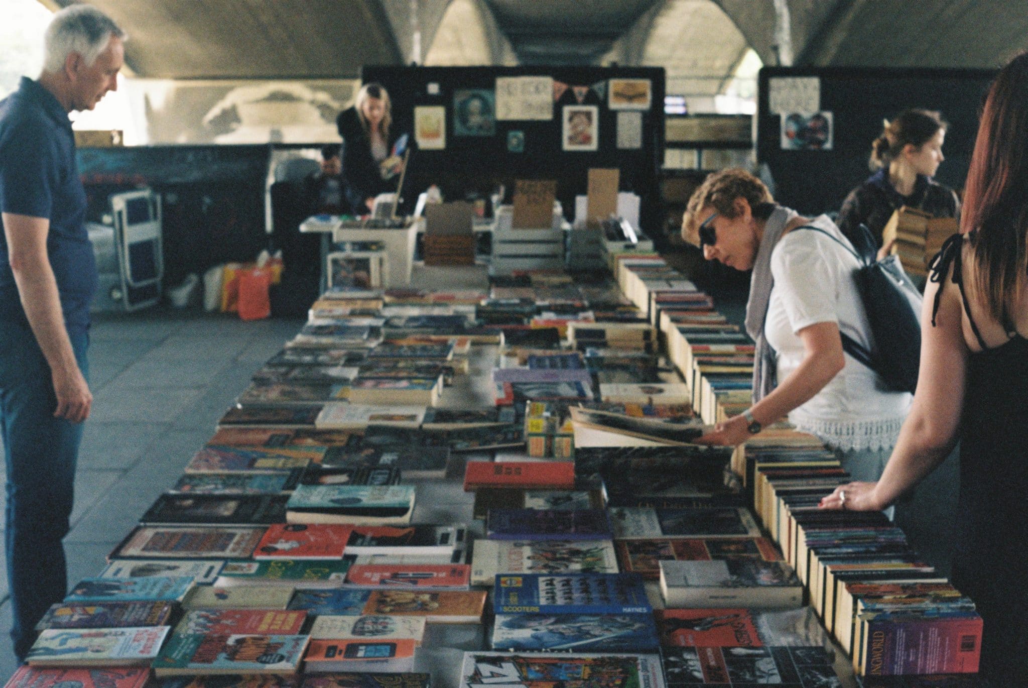 People shopping in a second-hand book store.