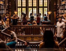 College students enjoying time in a library for free.