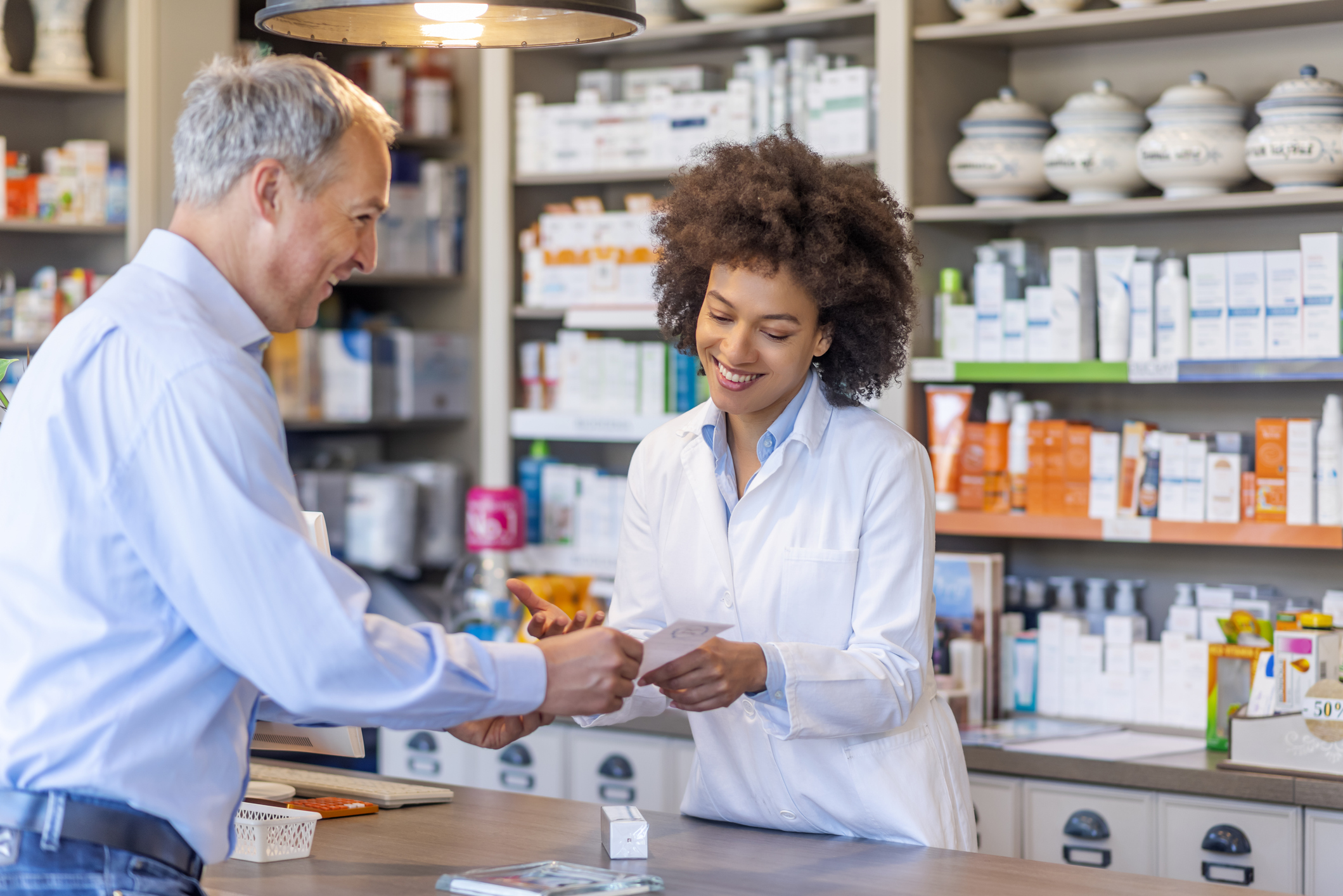 Pharmacy technician working in pharmacy