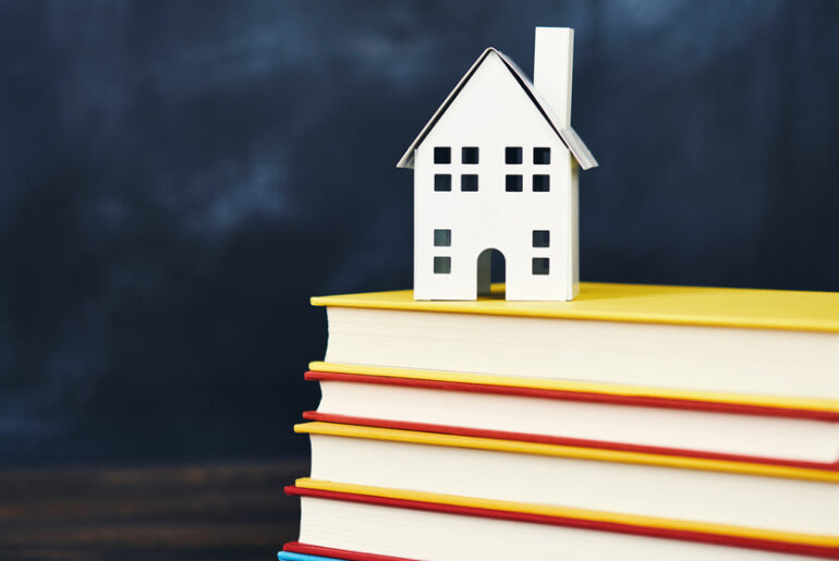 a house on a stack of books representing homeschool