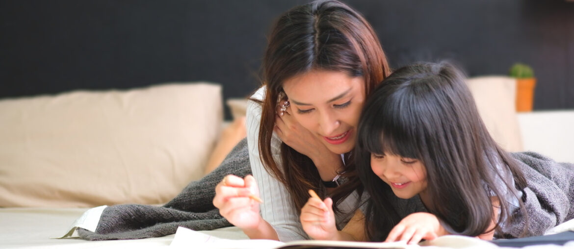 mother homeschooling her daughter