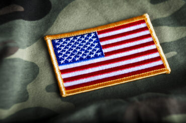 military officer in training and American flag patch