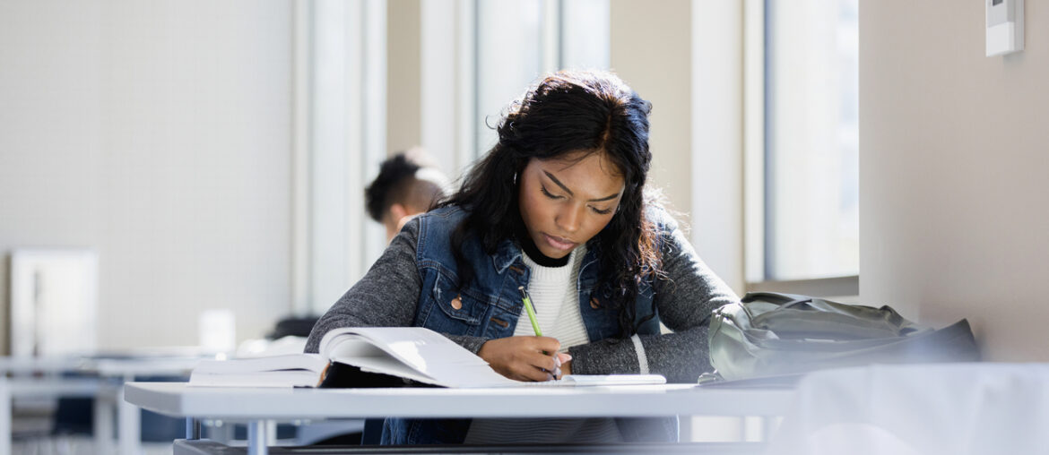 Student studying for the TACHS exam to ensure their success.