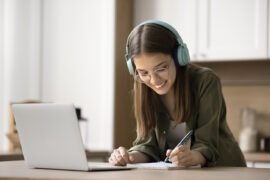 A girl tracking progress from her HSPT practice test scores to set goals