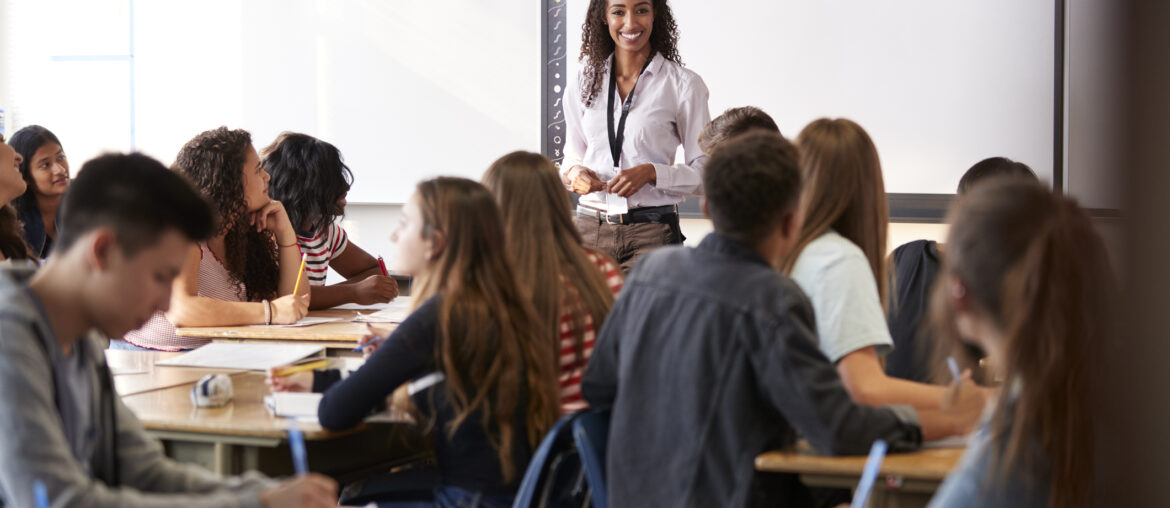 Inside an AP Classroom looking at teacher with her students