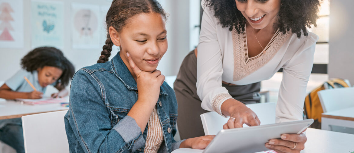 Teacher using data-driven instruction to guide a student in their learning