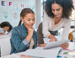 Teacher using data-driven instruction to guide a student in their learning