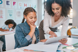 Teacher using data-driven instruction to guide a student in their learning