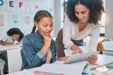 Teacher using data-driven instruction to guide a student in their learning