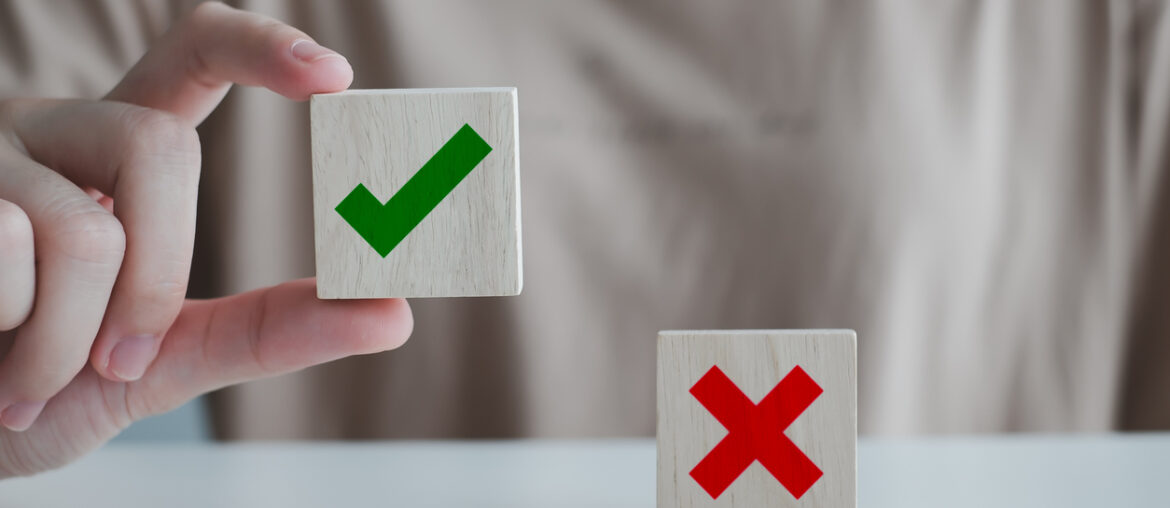 A student holding a block up to indicate clep credit being accepted at his school