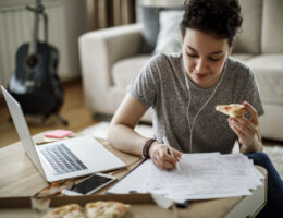 Busy student taking ACT practice test while eating