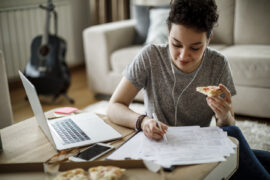 Busy student taking ACT practice test while eating