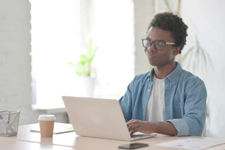 A student on a laptop realizing that they made a mistake and should've taken ACT Test Advice