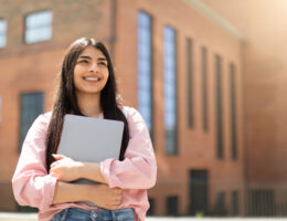 Teenager looking hopefully at the skyline because of the ACT changes