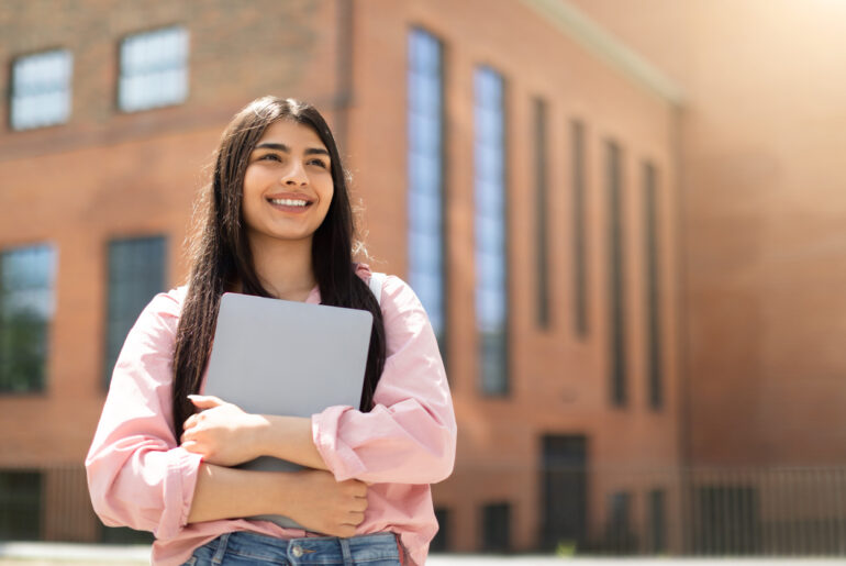 Teenager looking hopefully at the skyline because of the ACT changes