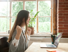 Student excited to earn credit by researching CLEP exam pass rates