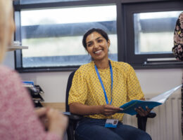 Teacher smiling about high school test prep solutions and planning