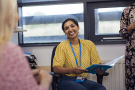 Teacher smiling about high school test prep solutions and planning
